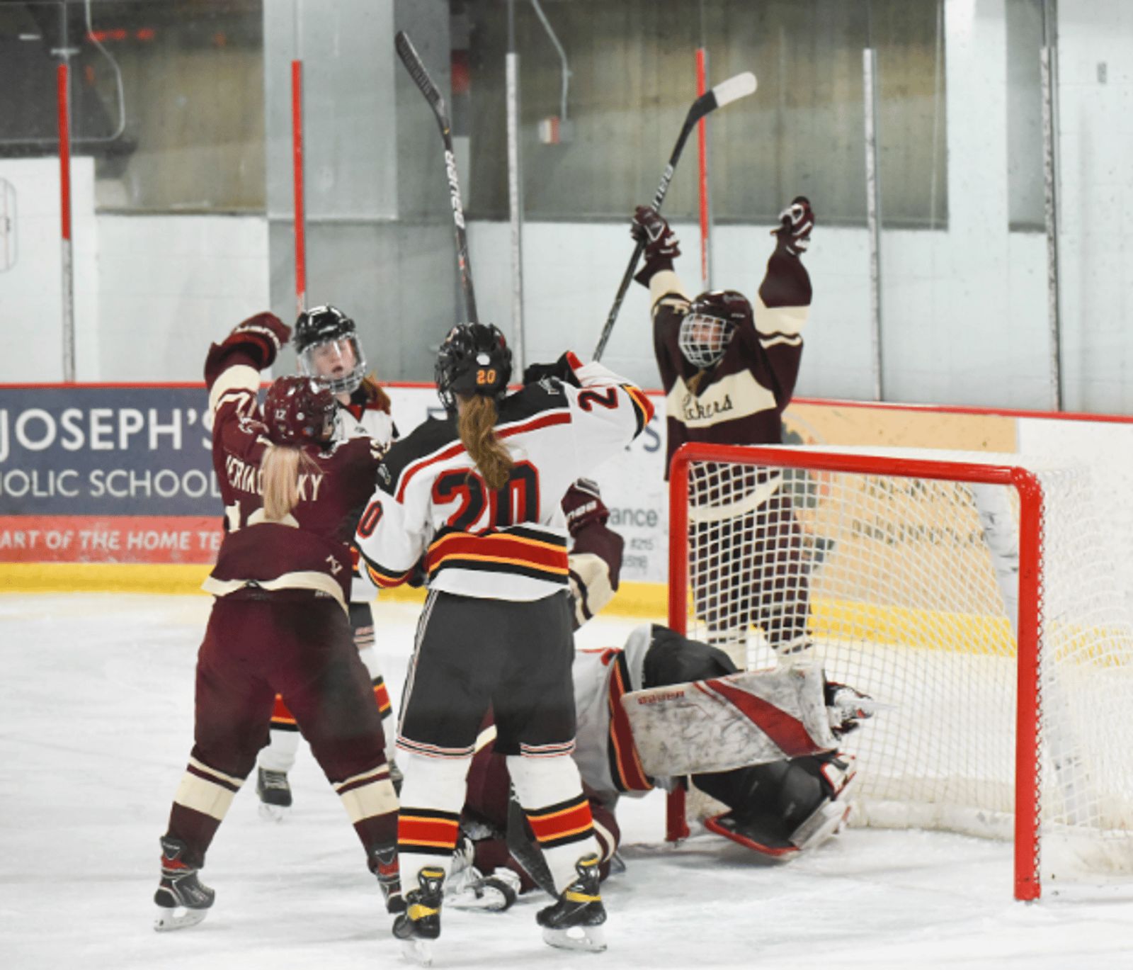 Packers celebrating a goal at the net